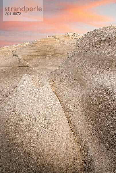 Sculpted Volcanic Rock Formations at Sunset on Sarakiniko Beach  Milos