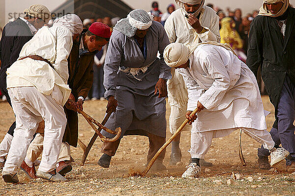 Berber playing with wooden stick costumes    Douiret  Southern Tunisia  Tunisia  Maghreb  North Africa  Africa