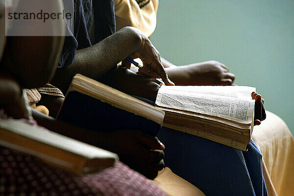 Women reading the Bible at a service in a Church  Southern Malawi  Africa