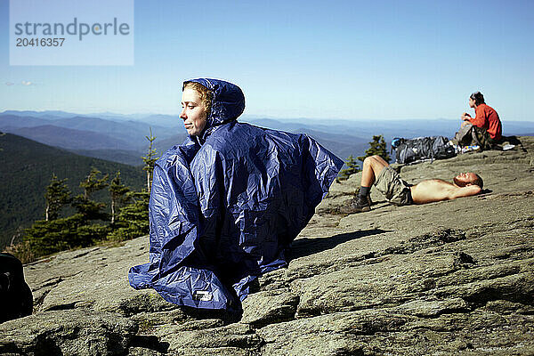 Hikers sit atop mt Killington.