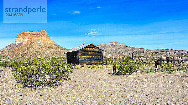 Abandoned farming settlement and barn in the desert