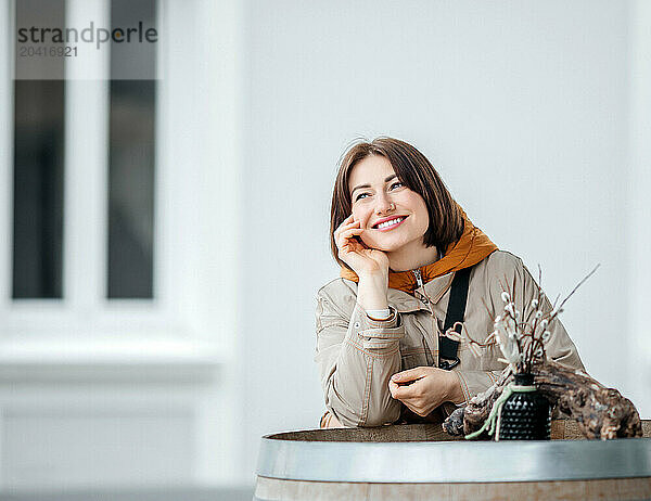 Content Young Lady Enjoying a Quiet Moment in Urban Serenity