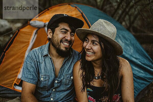 Portrait of Hispanic couple camping together