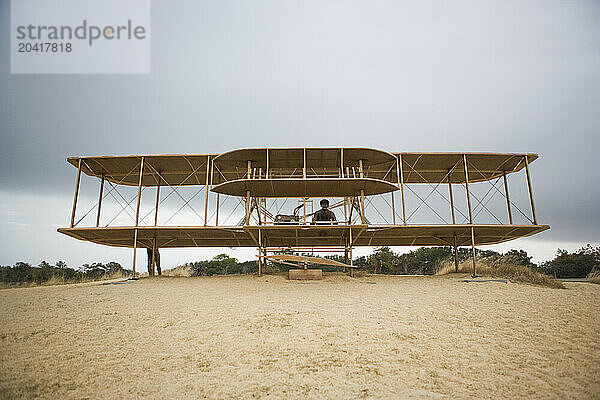 Airplane model and monument to commemorate the Wright brothers historic first flight  Kitty Hawk  North Carolina.