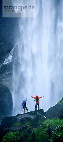 Couple hiking in the mist below Nevada Falls.