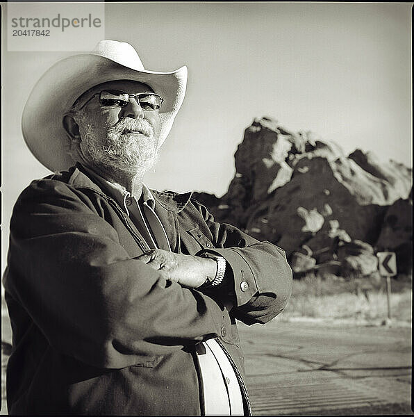 An employee of Hueco Tanks State Park poses for a portrait at the park entrance near El Paso  Texas