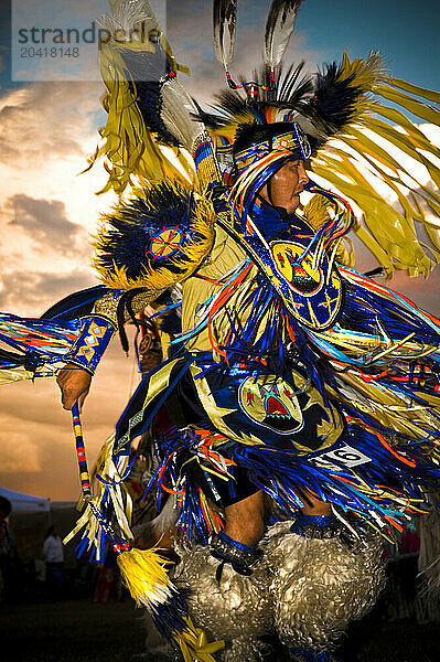 A Native American man participates in a dance at a powwow in Mesa Verde  Colorado.