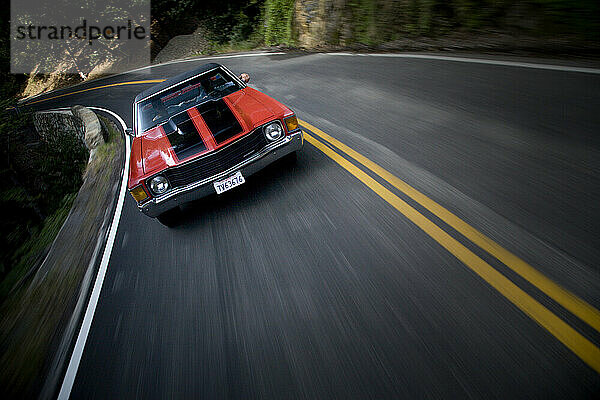 Red Muscle Car on a Mountain Road.