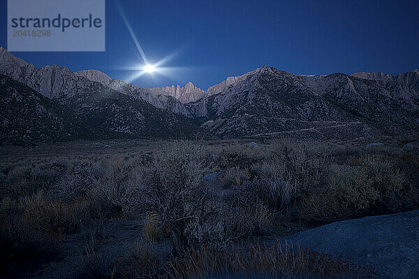 Full moon setting over Mt. Whitney in the Southern Sierra  Ca.