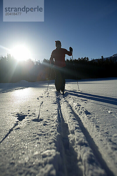 Young man cross country skiing.