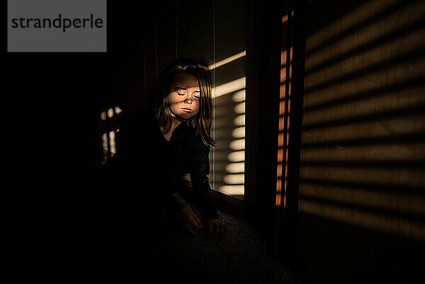 Beautiful girl resting in sun and shadows