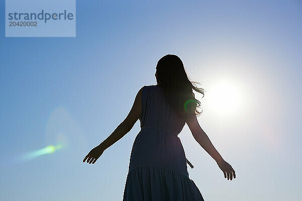 Japanese woman silhouette at sunset