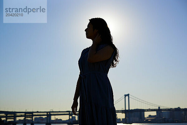 Japanese woman silhouette at sunset