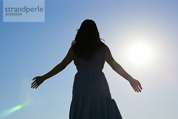 Japanese woman silhouette at sunset