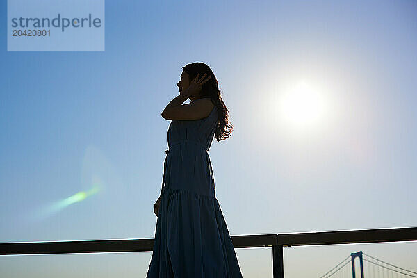 Japanese woman silhouette at sunset