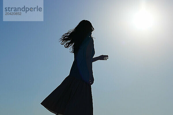 Japanese woman silhouette at sunset