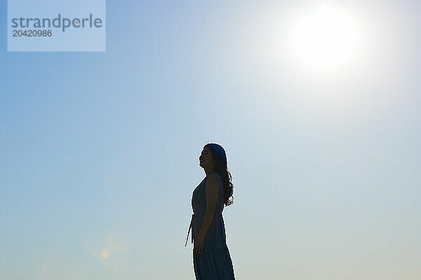 Japanese woman silhouette at sunset