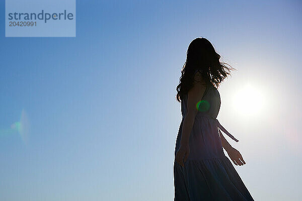 Japanese woman silhouette at sunset