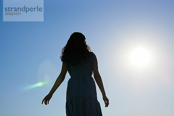 Japanese woman silhouette at sunset