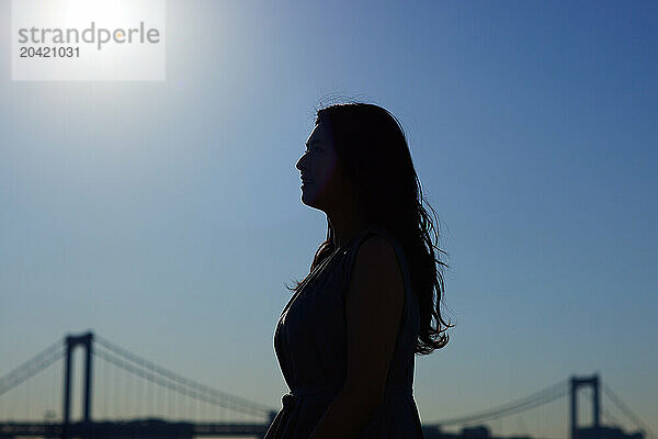 Japanese woman silhouette at sunset