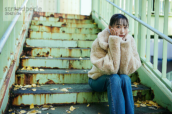 Young Japanese woman portrait in downtown Tokyo