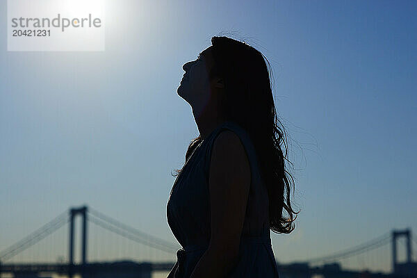 Japanese woman silhouette at sunset