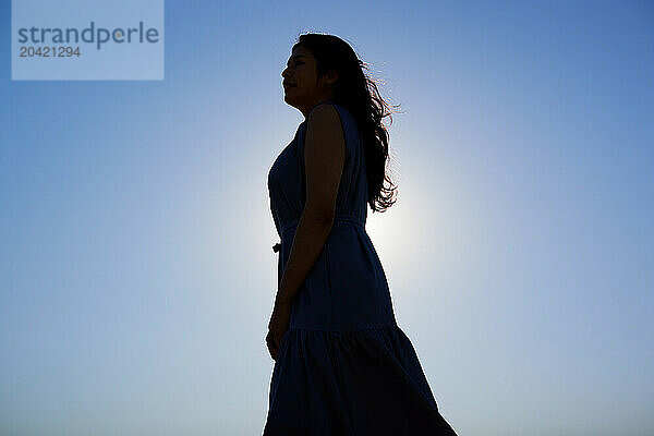 Japanese woman silhouette at sunset