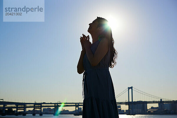 Japanese woman silhouette at sunset