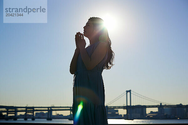 Japanese woman silhouette at sunset