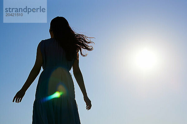 Japanese woman silhouette at sunset