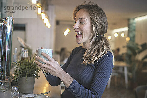 Woman having a capuccino in a bar  vintage modern style  barcelo