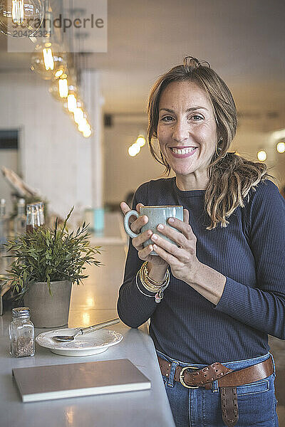 Woman having a capuccino in a bar  vintage modern style  barcelo