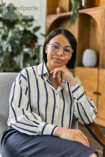 African American female therapist expert in eyeglasses smiling