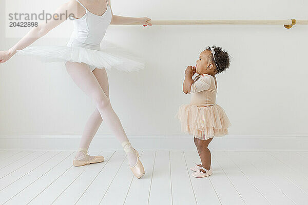 mixed race baby is excited to see real ballerina