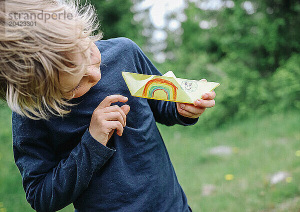 Happy child and his rainbow