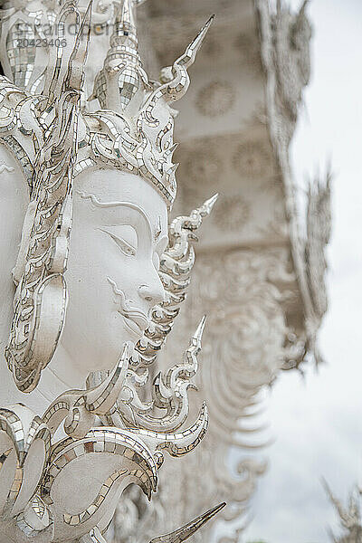 Buddhist religious white statue statue at the White Temple