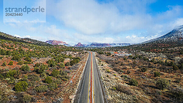 Sedona's red rock vistas on a snowy day  aerial highway view