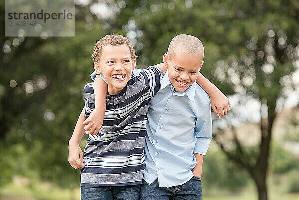 Brothers hugging and laughing together