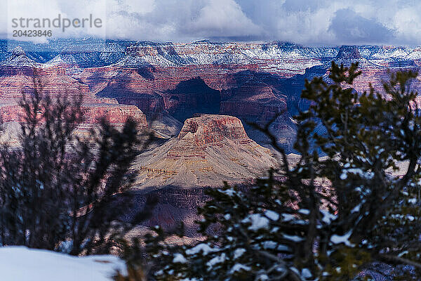 Mystic Winter View at Grand Canyon with Snow and Clouds