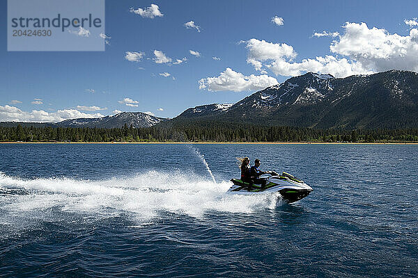 A couple rides a WaveRunner on Lake Tahoe  California.