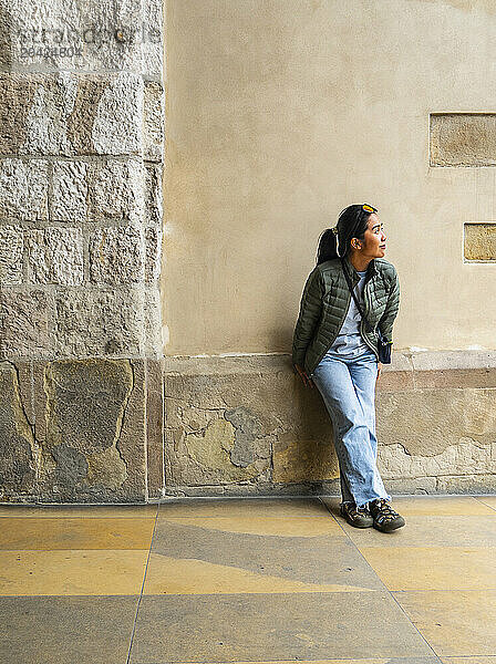 woman exploring Rynek Glowny Square in Krakow