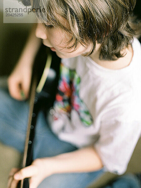 Boy playing guitar