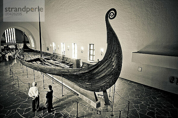 An old Viking ship is on display at the Viking Ship Museum  or Vikingskipshuset  in Oslo  Norway.