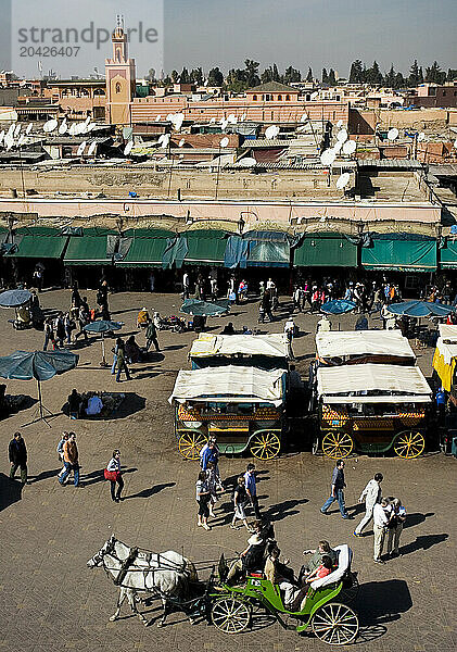 Activity abounds in the main square  the Djemaa el Fna  in Marrakesh  Morocco  in North Africa.