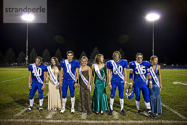 Portrait of football players and their dates on a football field in Coeur d'Alene  Idaho.