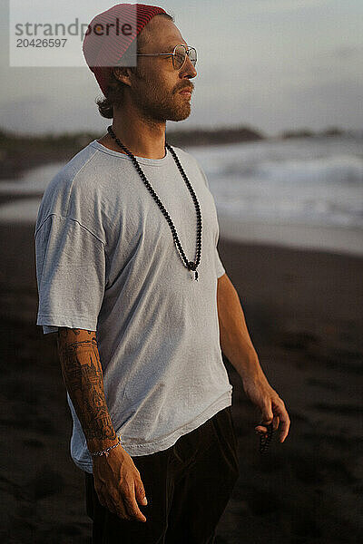 Portrait of smiling young man on the beach