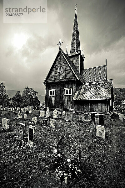 View of the small cemetery surrounding a church in Vaga  Norway.