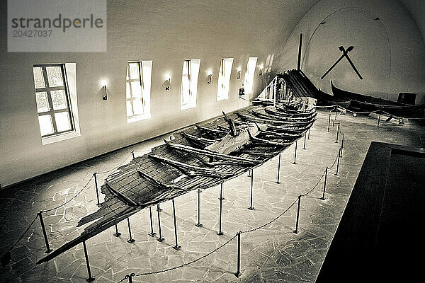 An old Viking ship is on display at the Viking Ship Museum  or Vikingskipshuset  in Oslo  Norway.