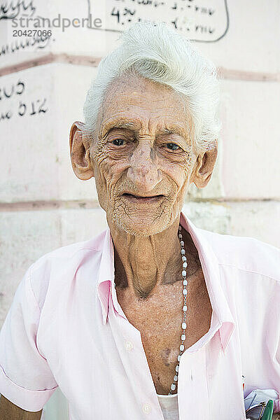 An older man poses for a portrait in Havana  Cuba.