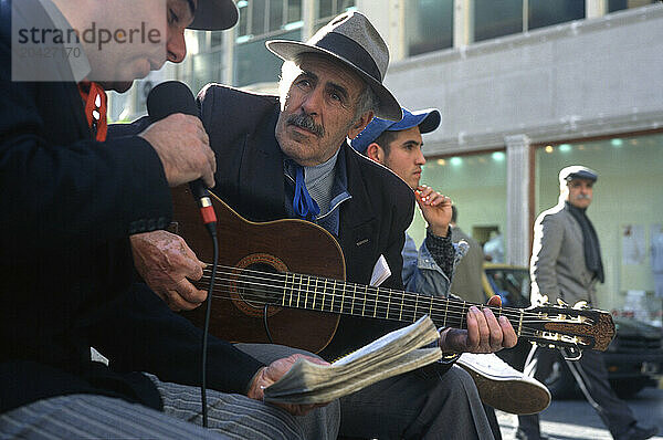 Musicians perform a traditional tango on the streets of central Buenos Aires.